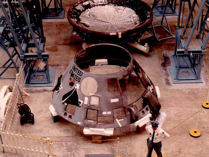 Apollo 1 command module being inspected aftert the fire that claimed the lives of the crew.
