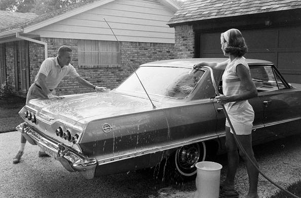 Frank and Susan wash the car for the Life Magazine photographer, circa 1963